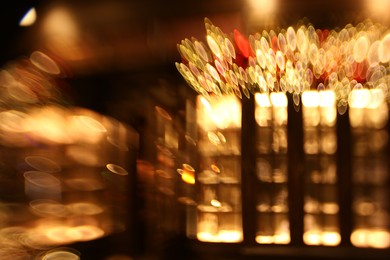 Photo of Blurred view of city street with lights, bokeh effect