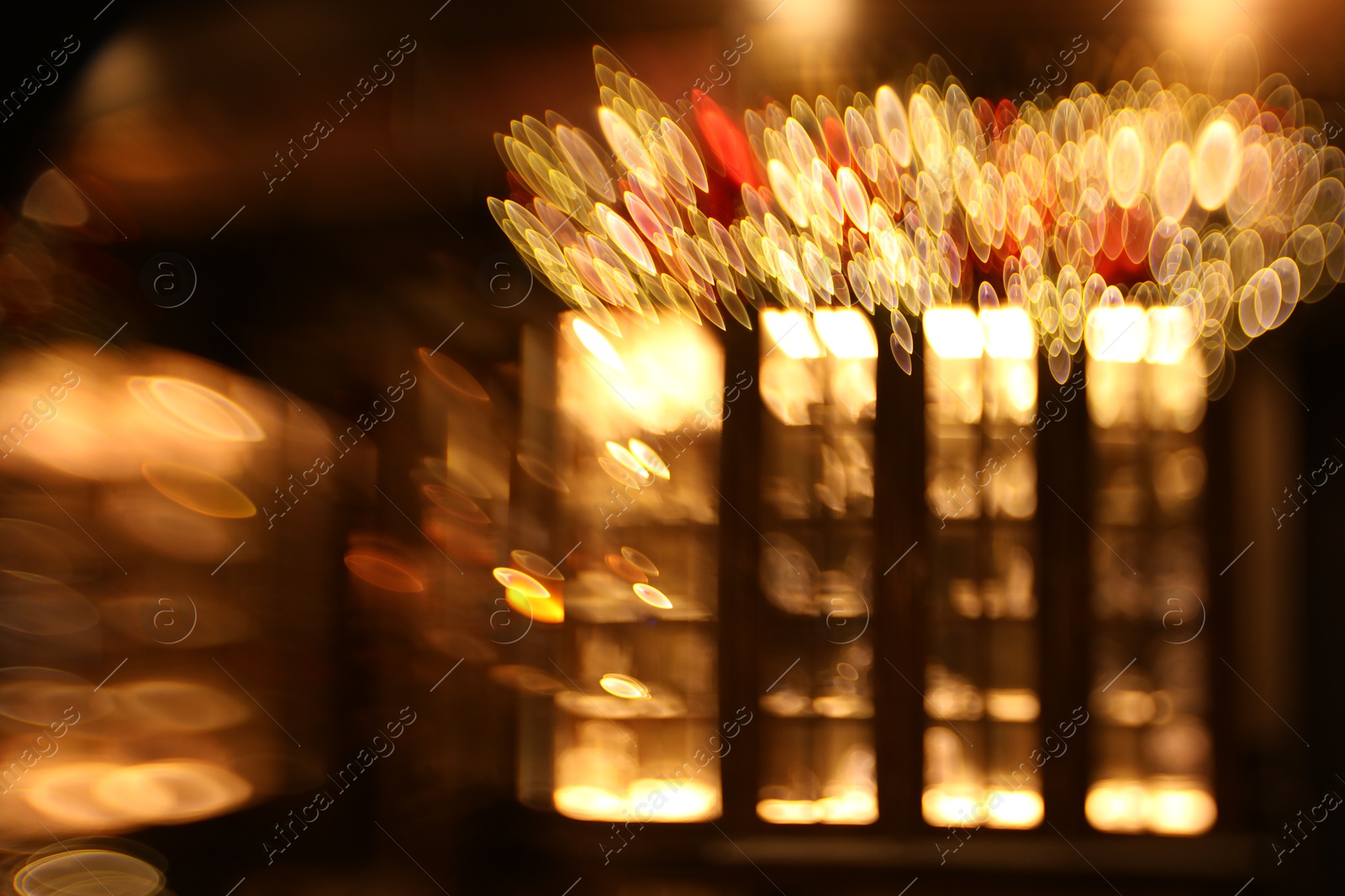 Photo of Blurred view of city street with lights, bokeh effect