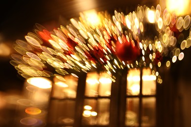 Photo of Blurred view of city street with lights, bokeh effect