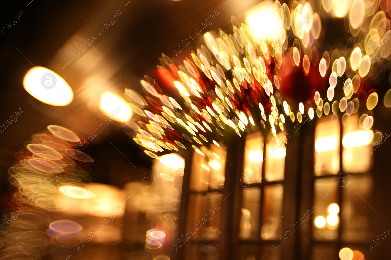 Photo of Blurred view of city street with lights, bokeh effect