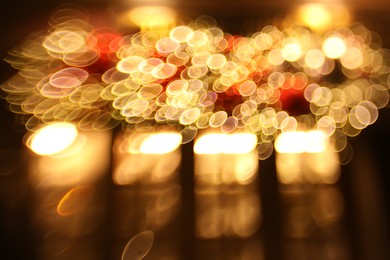 Photo of Blurred view of city street with lights, bokeh effect