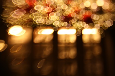 Photo of Blurred view of city street with lights, bokeh effect