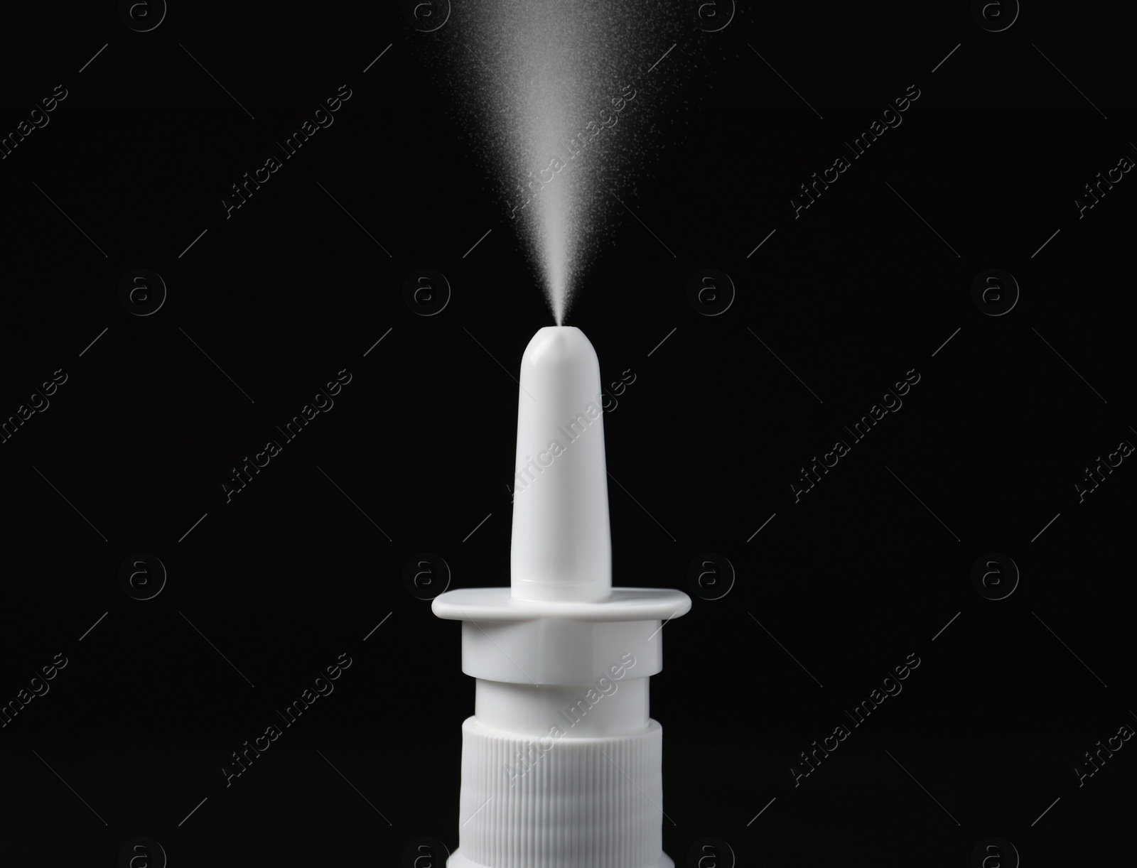 Image of Nasal spray with sprinkled medication over nozzle on black background, closeup