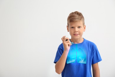 Image of Little boy with asthma inhaler on white background. Illustration of lungs