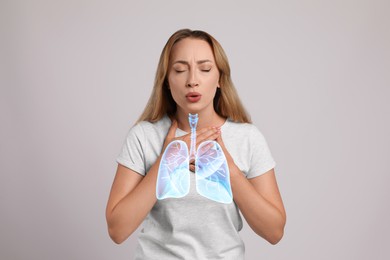 Woman with asthma suffering from difficulty breathing on grey background. Illustration of lungs