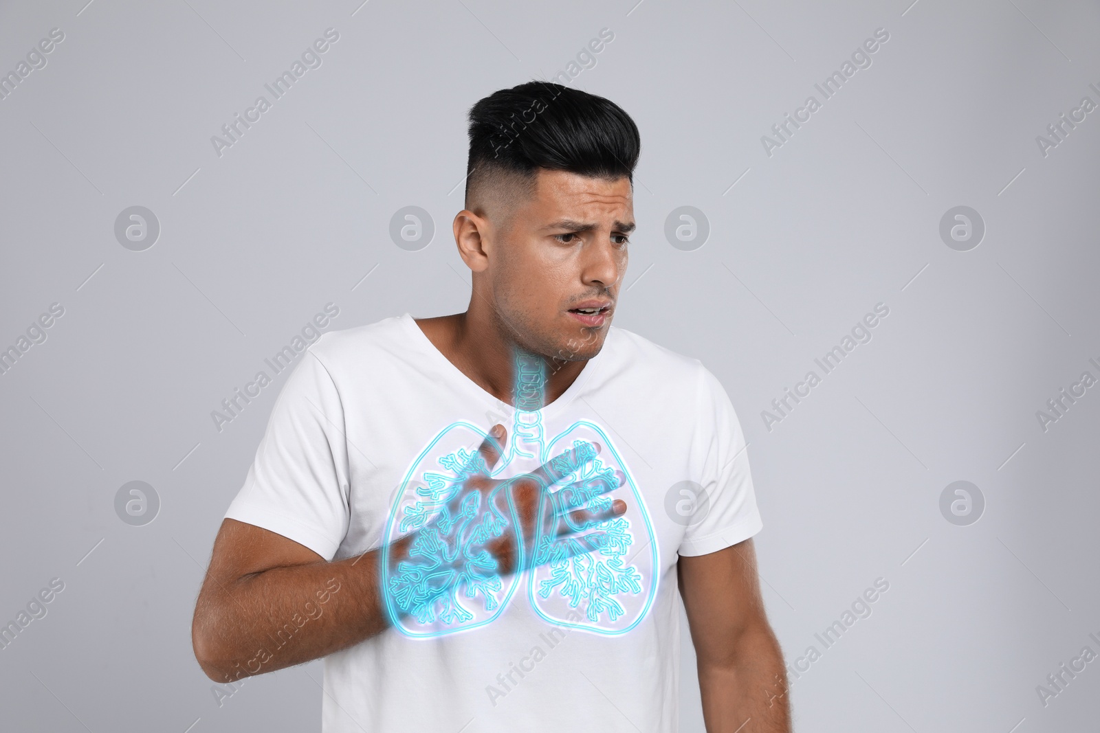 Image of Man with asthma suffering from difficulty breathing on grey background. Illustration of lungs