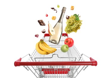 Image of Groceries falling into shopping cart on white background