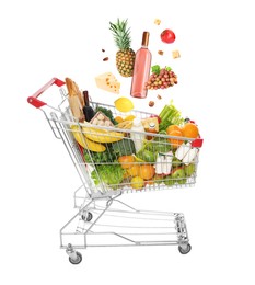 Image of Groceries falling into shopping cart on white background