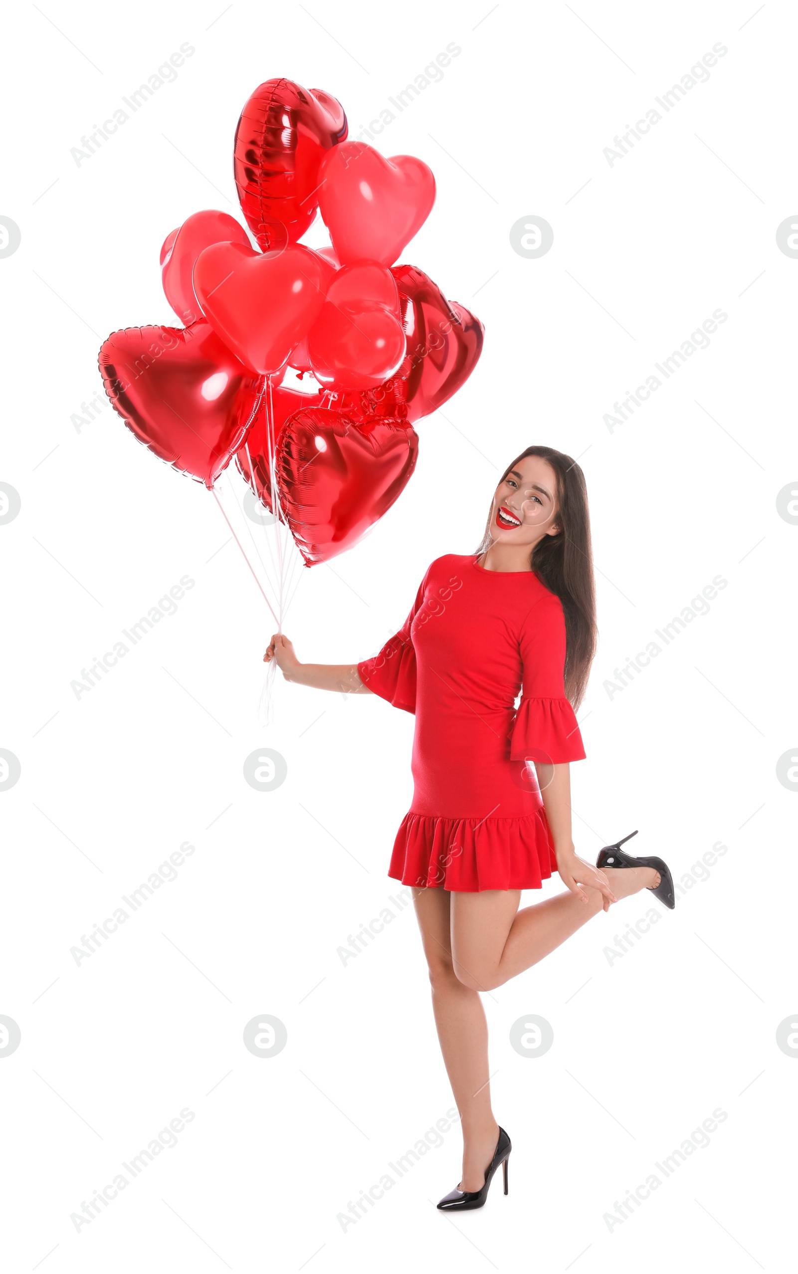 Photo of Beautiful girl with heart shaped balloons isolated on white. Valentine's day celebration