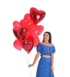 Beautiful young woman with heart shaped balloons isolated on white. Valentine's day celebration