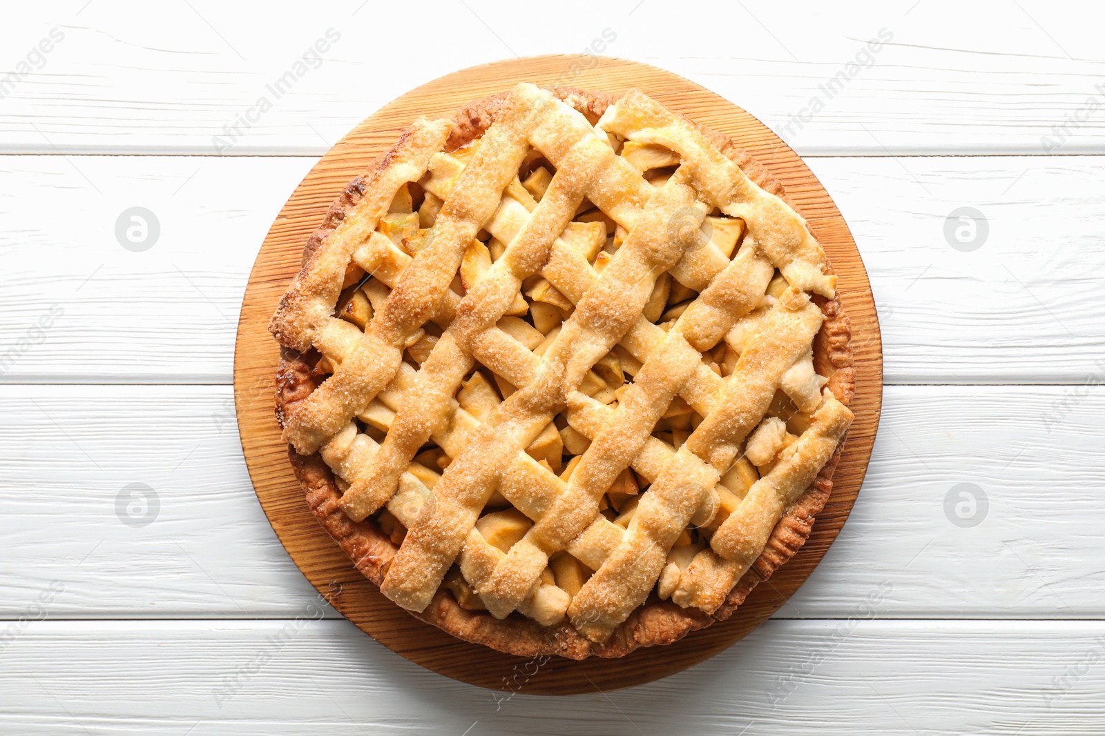 Photo of Tasty homemade apple pie on white wooden table, top view