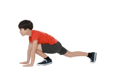 Photo of Boy doing exercise on white background. Sport activity