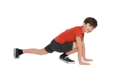 Photo of Boy doing exercise on white background. Sport activity