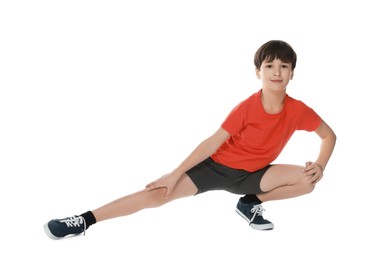 Photo of Boy doing exercise on white background. Sport activity