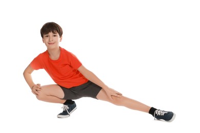 Photo of Boy doing exercise on white background. Sport activity