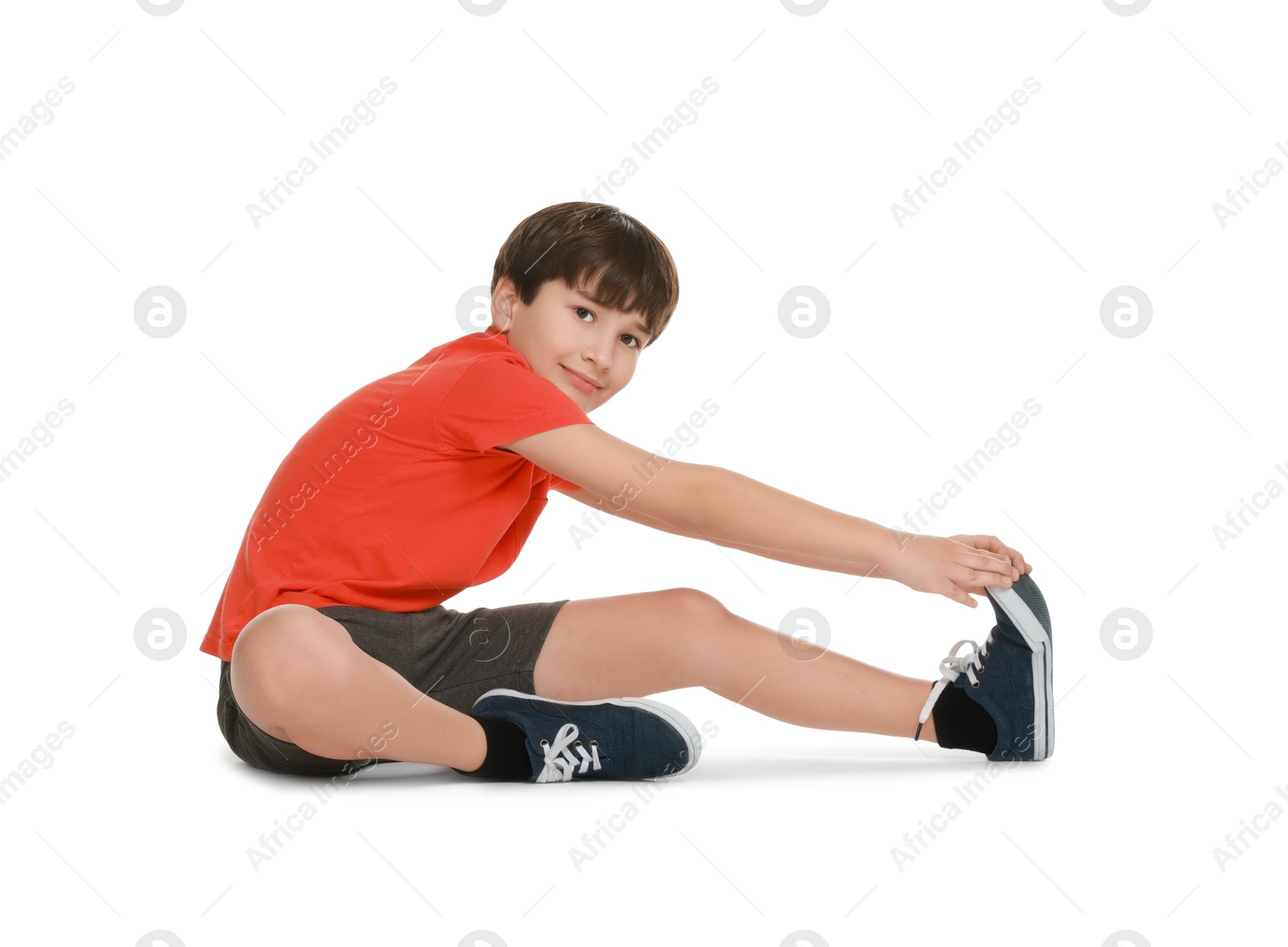 Photo of Boy doing exercise on white background. Sport activity