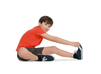 Photo of Boy doing exercise on white background. Sport activity