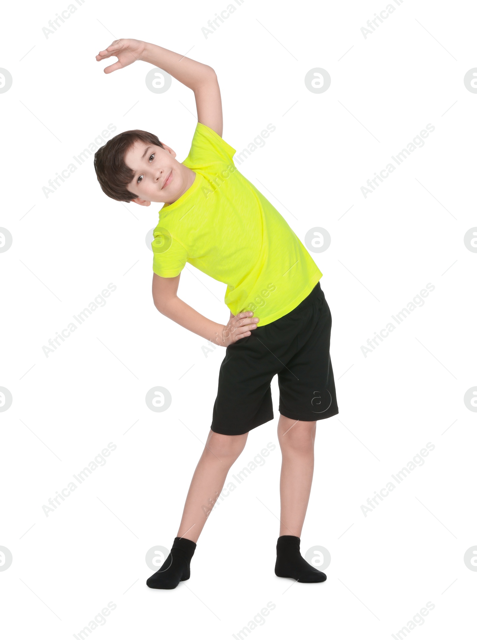 Photo of Boy doing exercise on white background. Sport activity