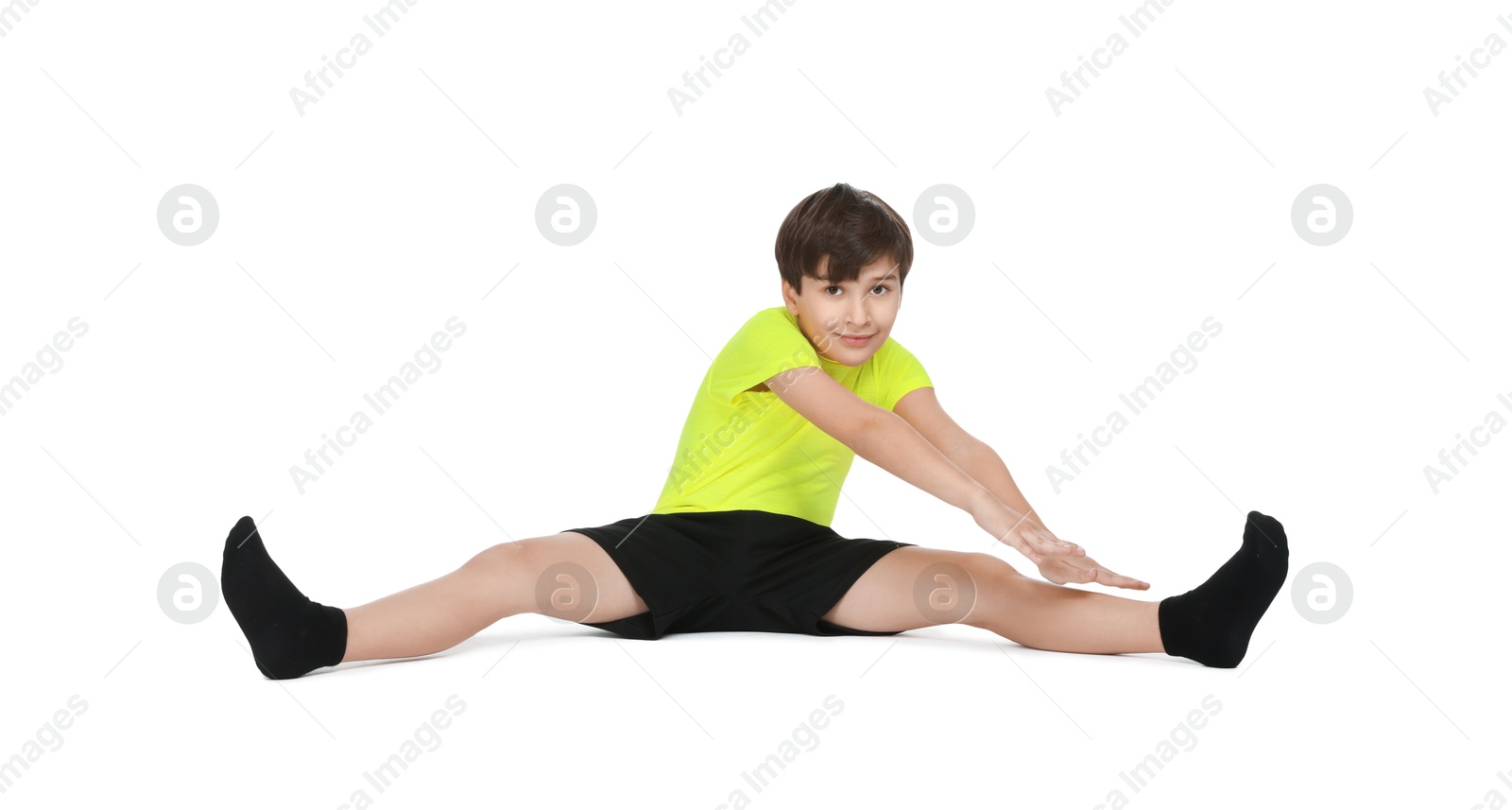 Photo of Boy doing exercise on white background. Sport activity