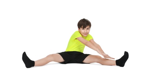 Photo of Boy doing exercise on white background. Sport activity