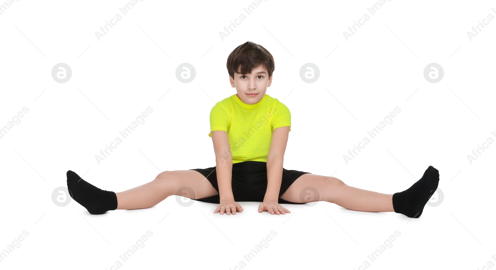 Photo of Boy doing exercise on white background. Sport activity