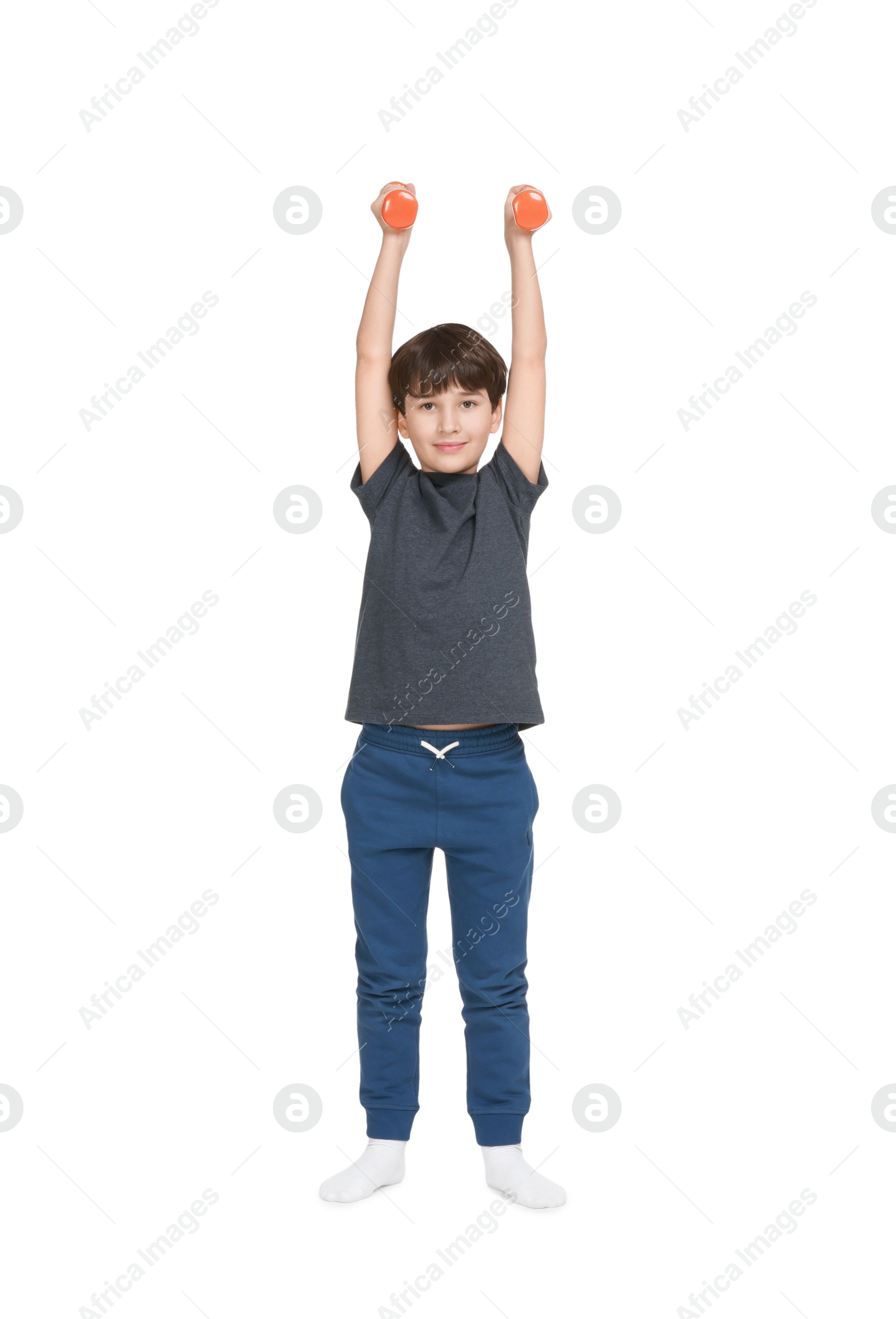 Photo of Boy doing exercise with dumbbells on white background. Sport activity