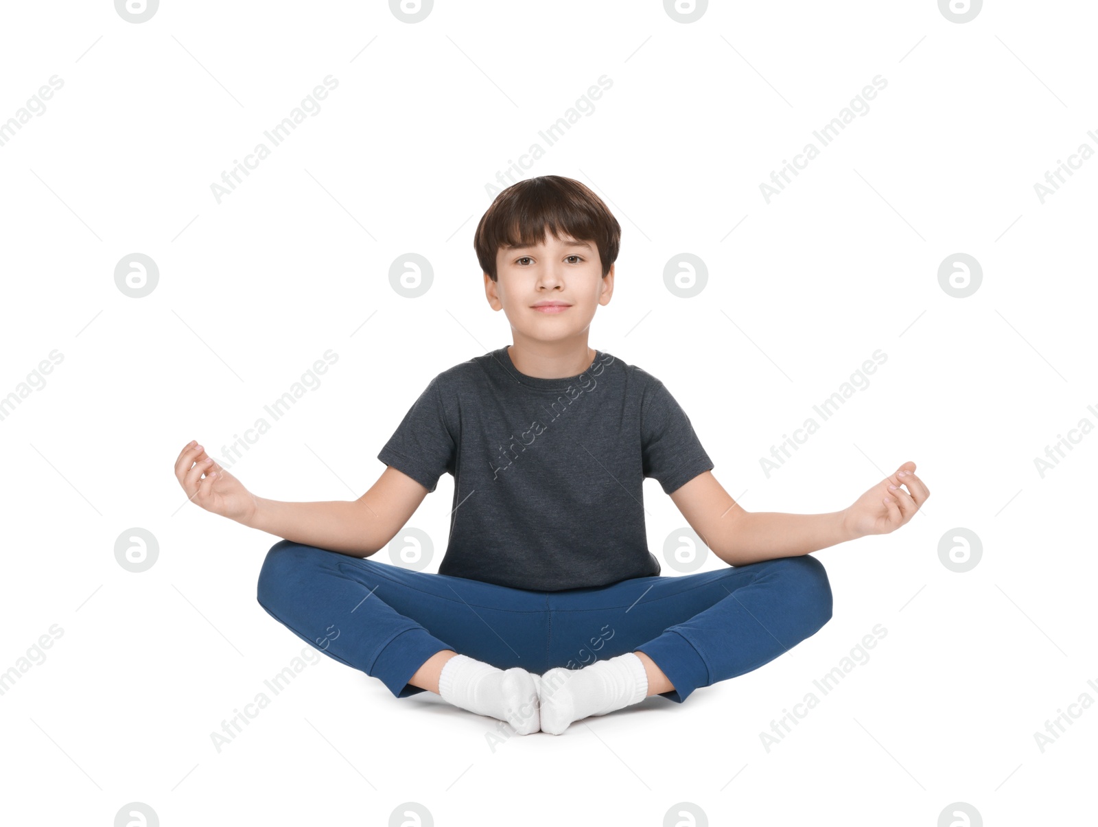 Photo of Boy doing exercise on white background. Sport activity