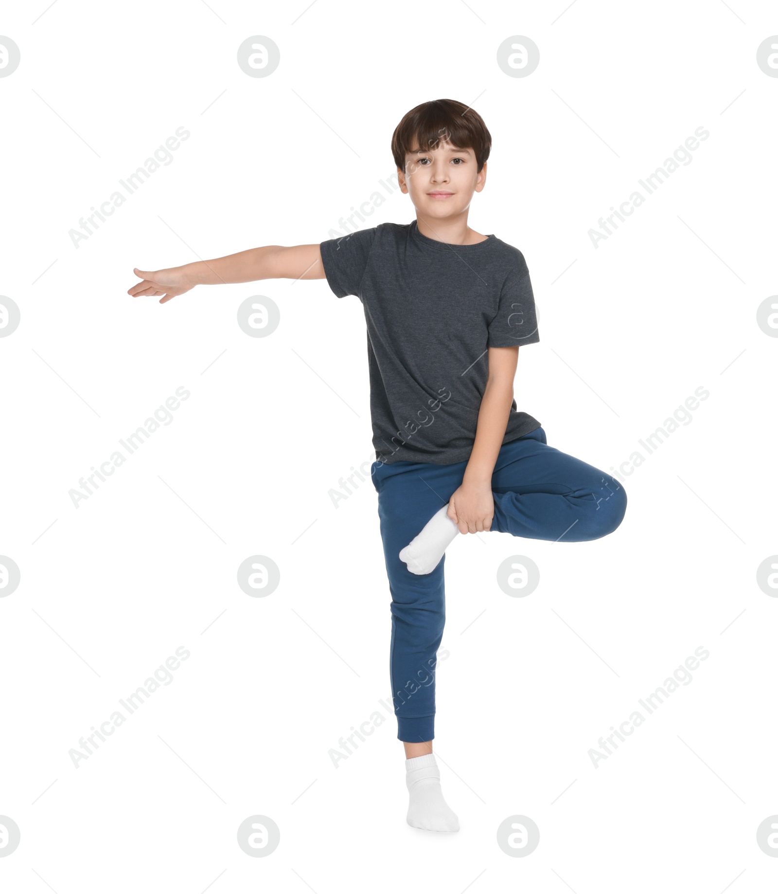 Photo of Boy doing exercise on white background. Sport activity