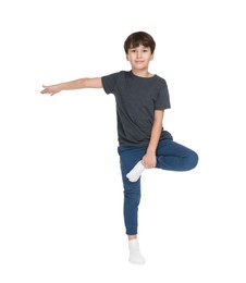 Photo of Boy doing exercise on white background. Sport activity