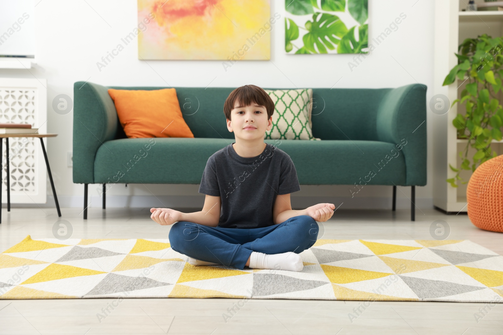 Photo of Boy doing exercise at home. Sport activity