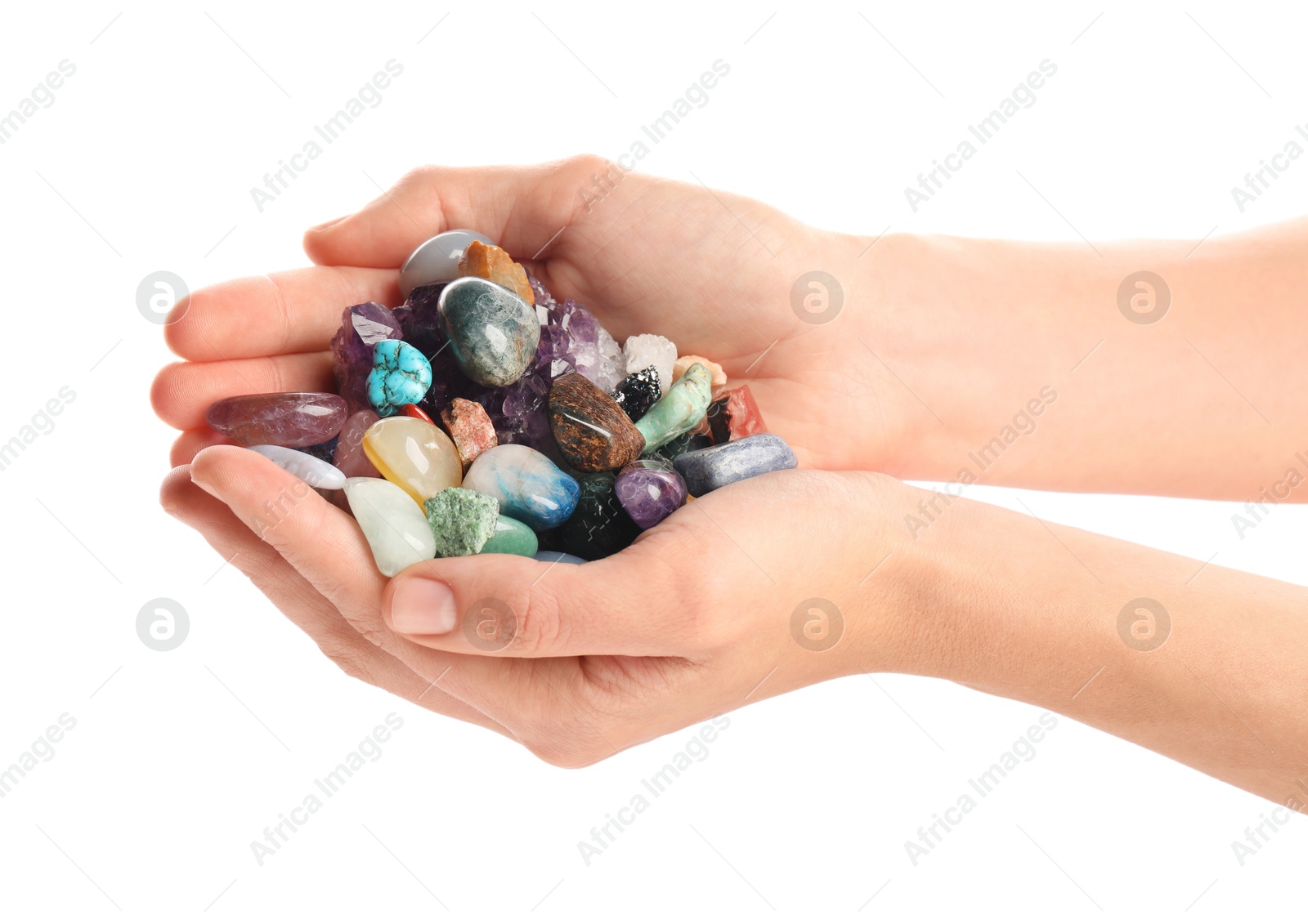 Photo of Woman holding different natural mineral stones on white background, closeup