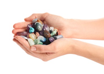 Photo of Woman holding different natural mineral stones on white background, closeup