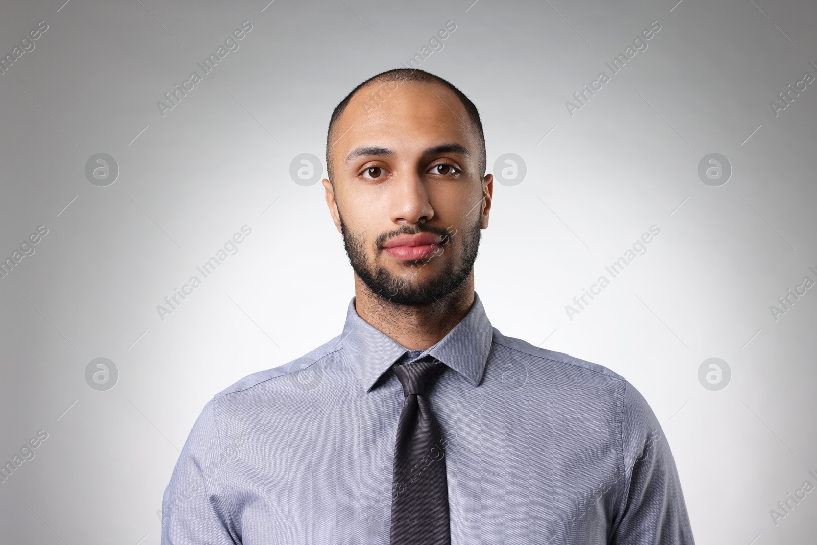 Photo of Portrait of businessman on light gray background