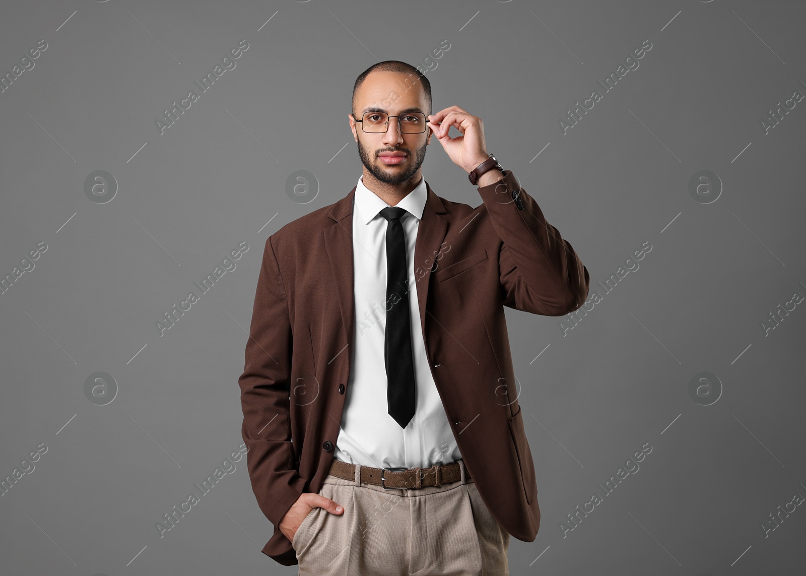 Photo of Portrait of businessman in glasses on gray background