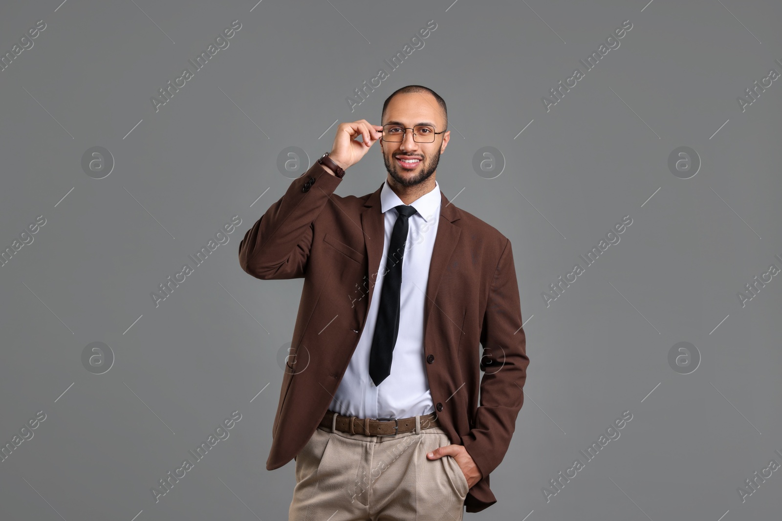 Photo of Portrait of businessman in glasses on gray background