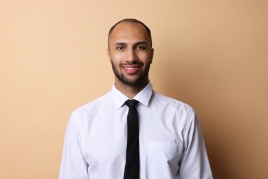 Photo of Portrait of businessman with necktie on beige background