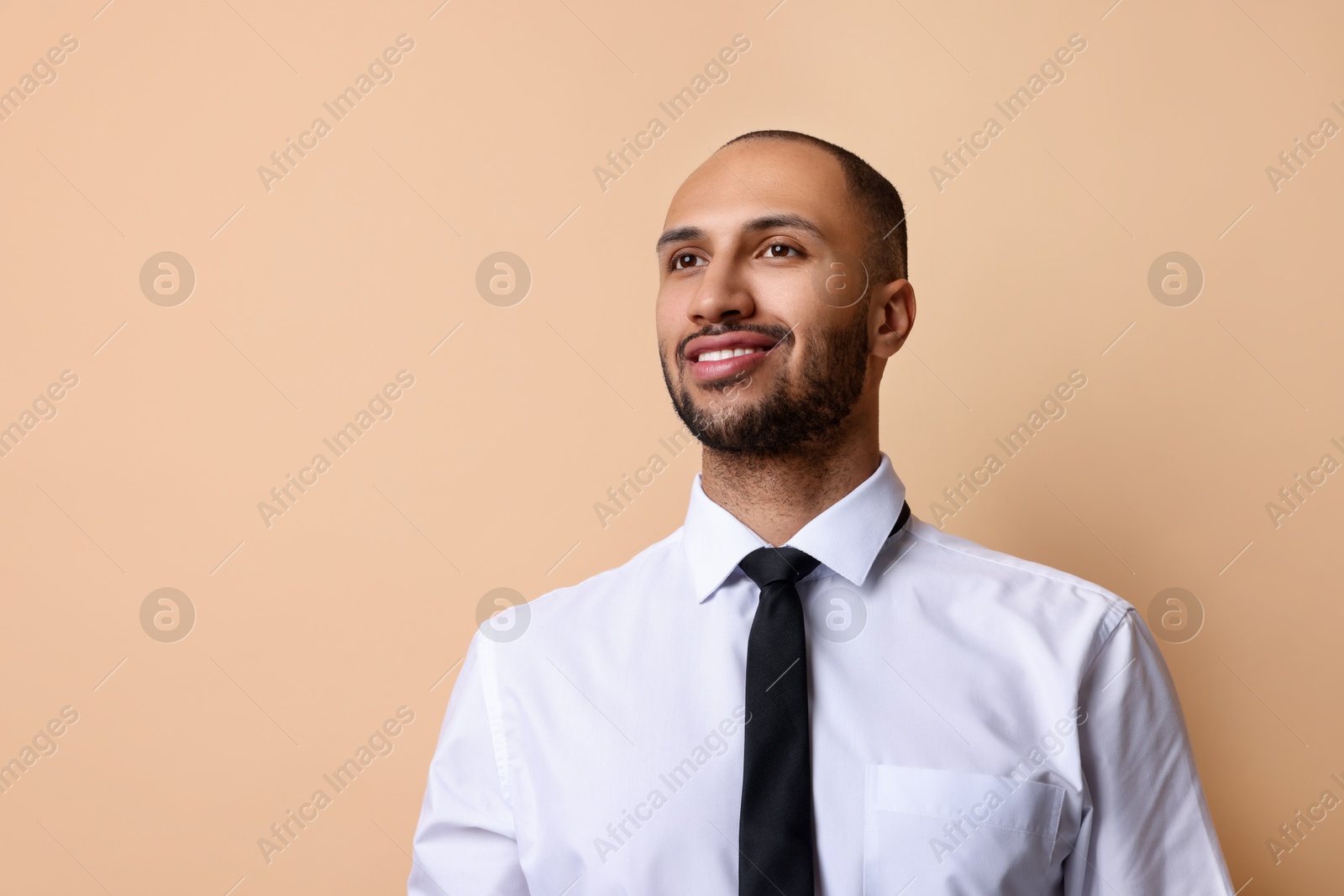 Photo of Portrait of businessman on beige background, space for text