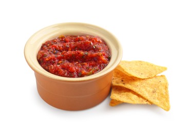 Photo of Tasty salsa sauce in bowl and tortilla chips isolated on white