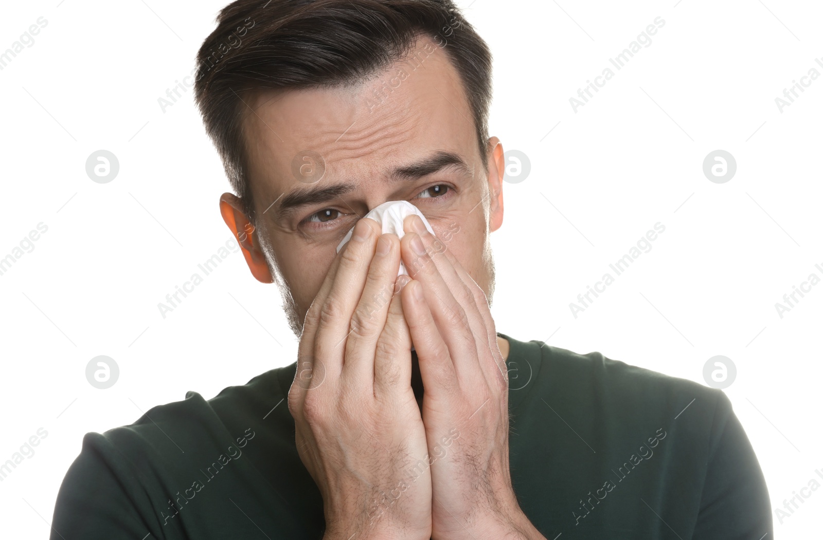 Photo of Sad man with paper tissue crying on white background