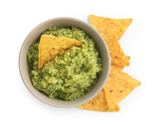 Photo of Delicious homemade green salsa with nachos isolated on white, top view