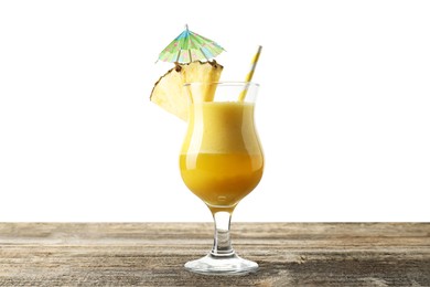 Photo of Tasty pineapple cocktail in glass on wooden table against white background