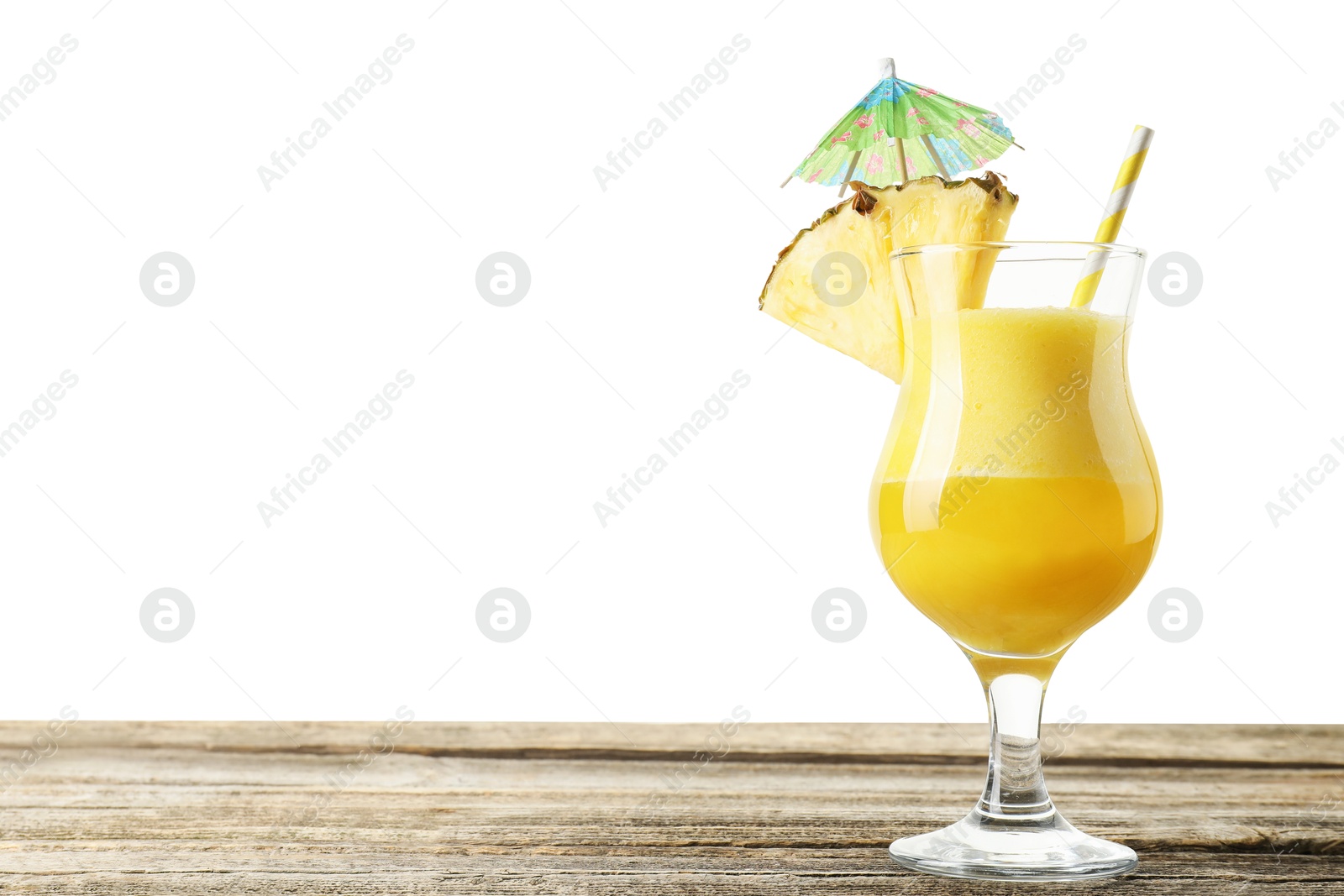 Photo of Tasty pineapple cocktail in glass on wooden table against white background