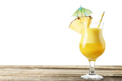 Photo of Tasty pineapple cocktail in glass on wooden table against white background