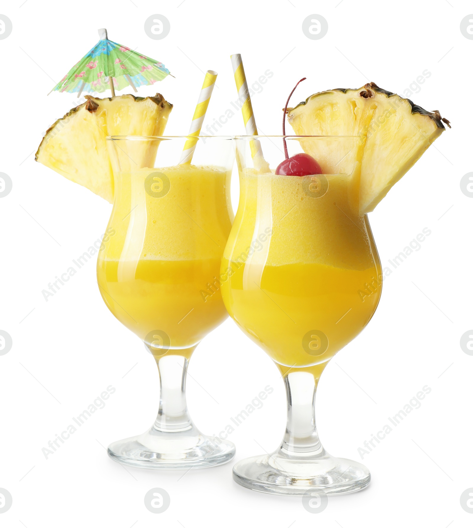 Photo of Tasty pineapple cocktail in glasses isolated on white