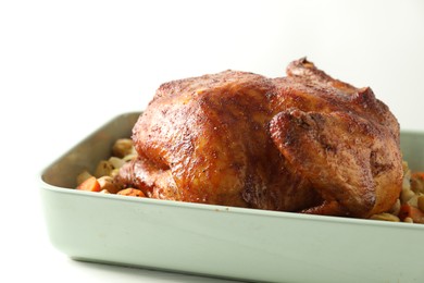 Photo of Delicious baked turkey and vegetables in baking dish on white table, closeup