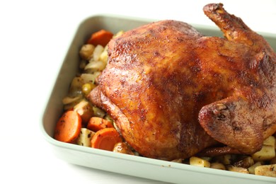 Photo of Delicious baked turkey and vegetables in baking dish on white table, closeup