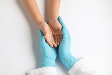 Photo of Doctor and child on white background, top view