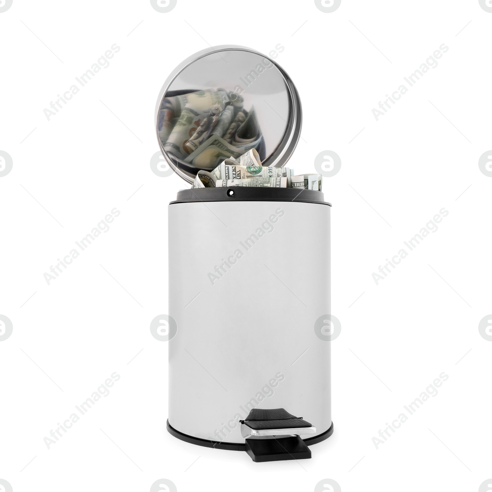 Photo of Dollar banknotes in trash bin on white background