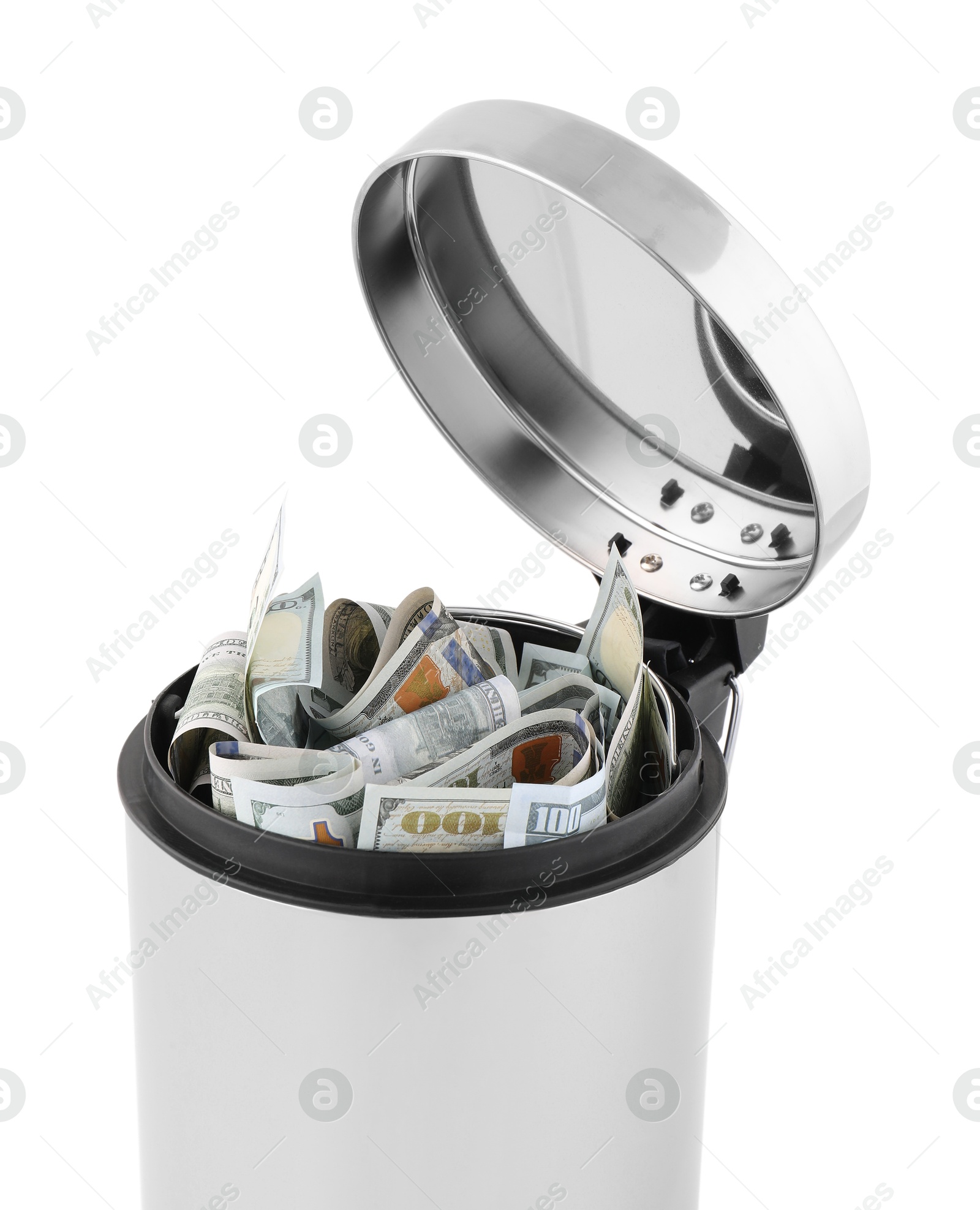 Photo of Dollar banknotes in trash bin on white background