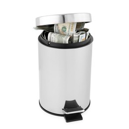 Photo of Dollar banknotes in trash bin on white background